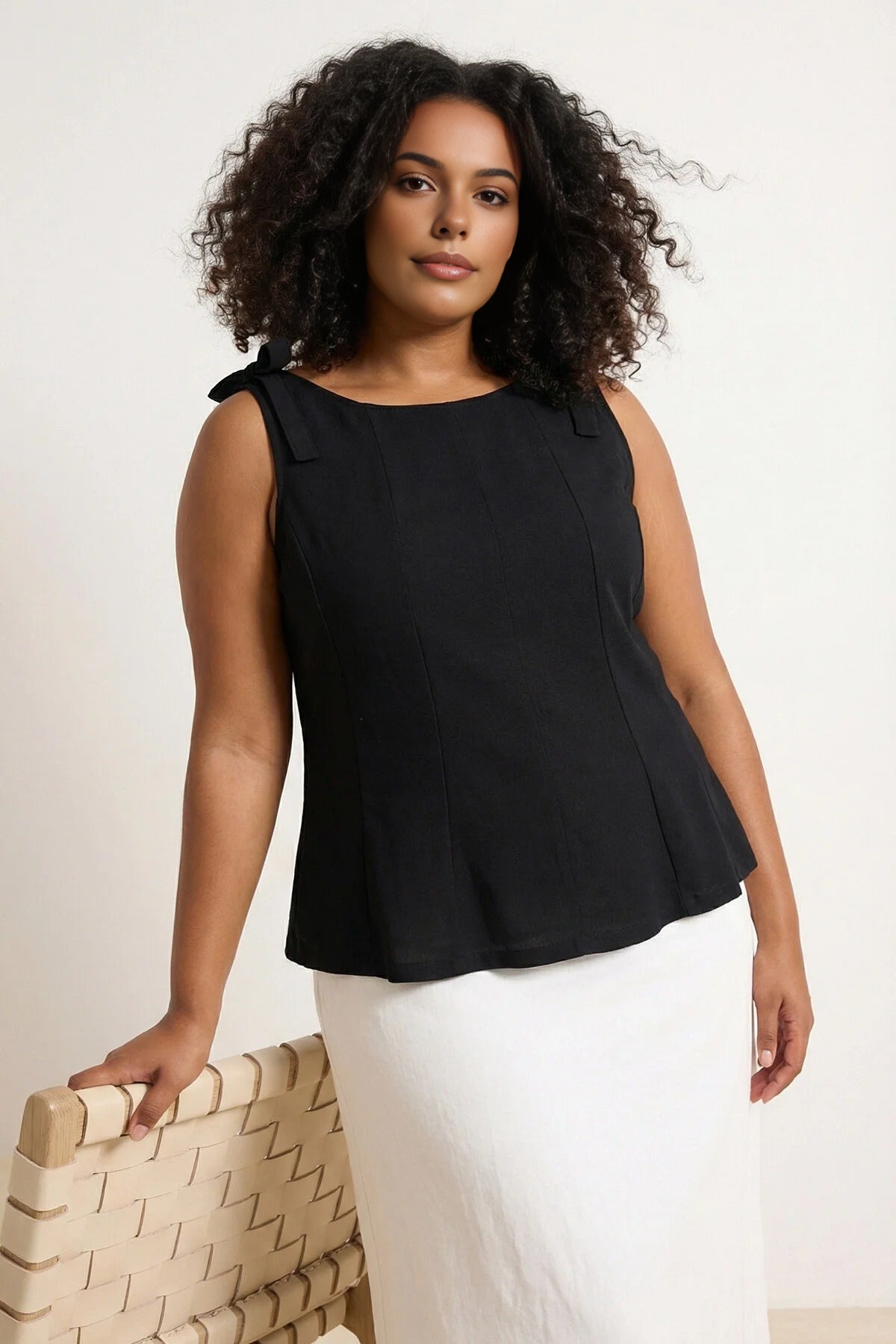 Sleeveless Peplum Blouse with Waist and Shoulder Bow Detail