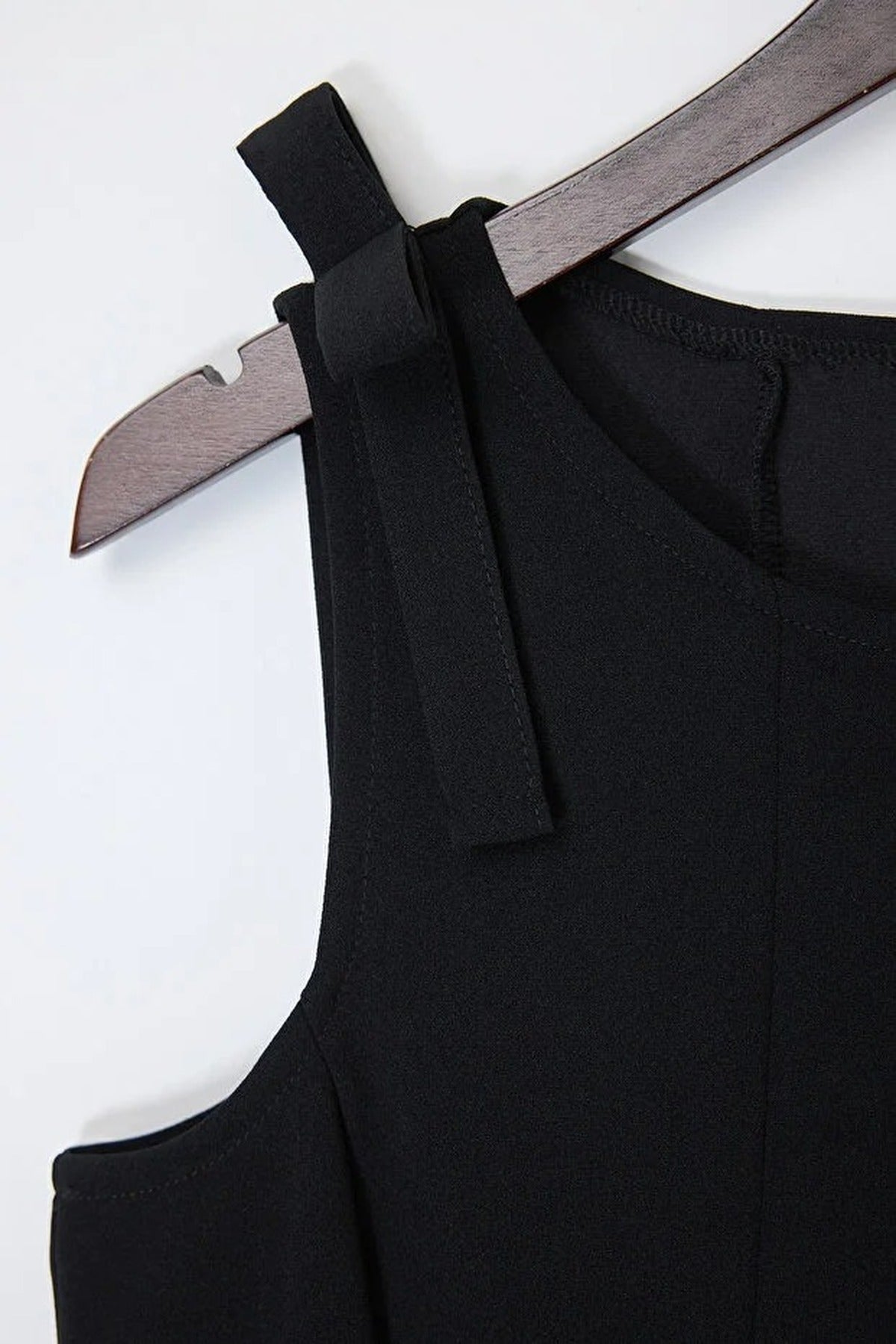 Sleeveless Peplum Blouse with Waist and Shoulder Bow Detail